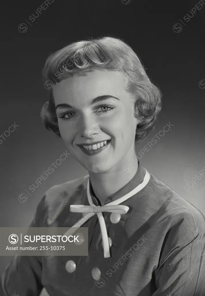 Vintage Photograph. Woman with short hair in blouse looking at camera. Frame