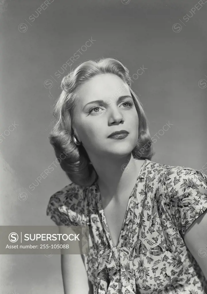 Vintage photograph. Close-up of a young woman thinking