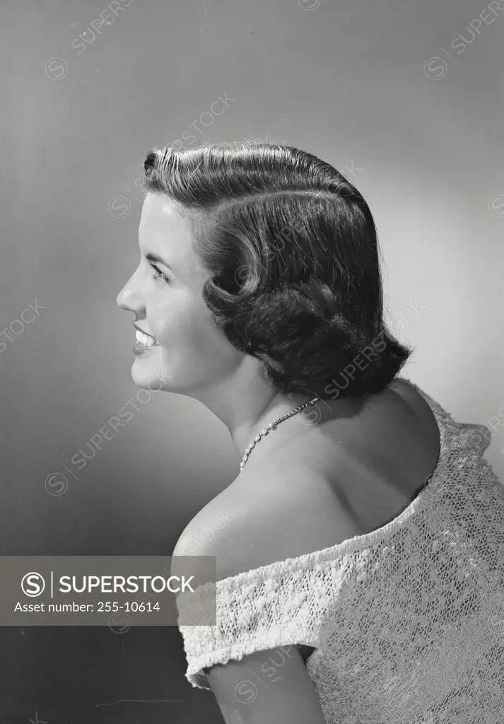 Vintage photograph. Profile portrait of smiling woman