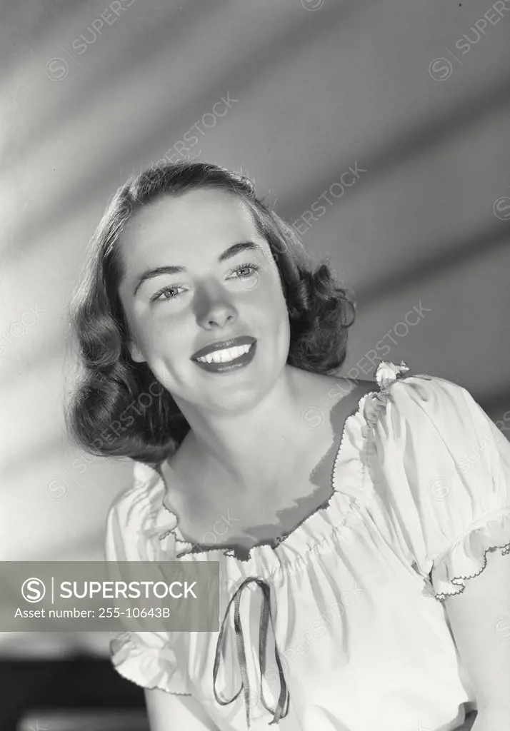 Vintage photograph. Close-up of a young woman smiling