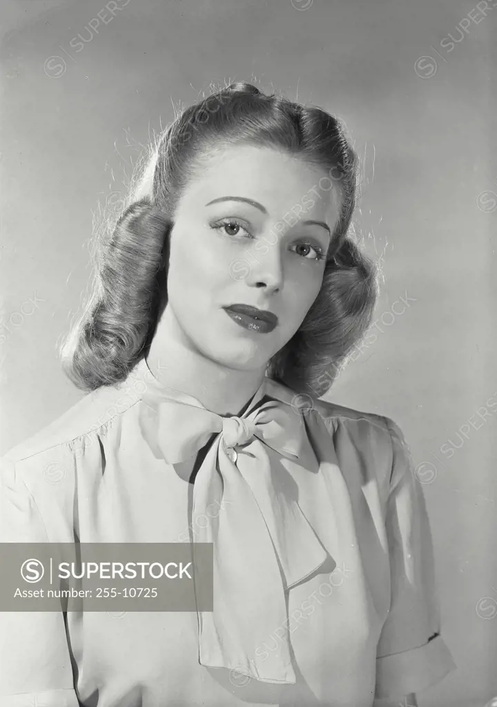Vintage Photograph. Woman wearing blouse with bow around collar