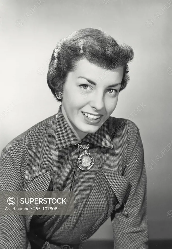 Vintage photograph. Woman with short hair smiling looking at camera