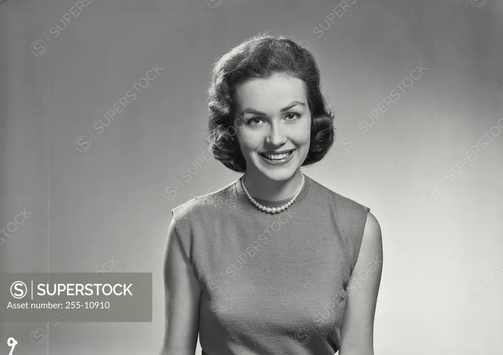 Vintage Photograph. Portrait of woman in sleeveless blouse.