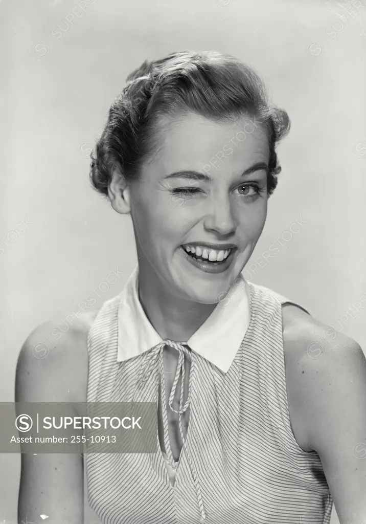 Vintage Photograph. Portrait of woman in sleeveless blouse smiling. Frame 2