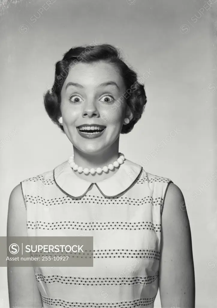 Vintage Photograph. Woman in sleeveless blouse smiling wide. Frame 1