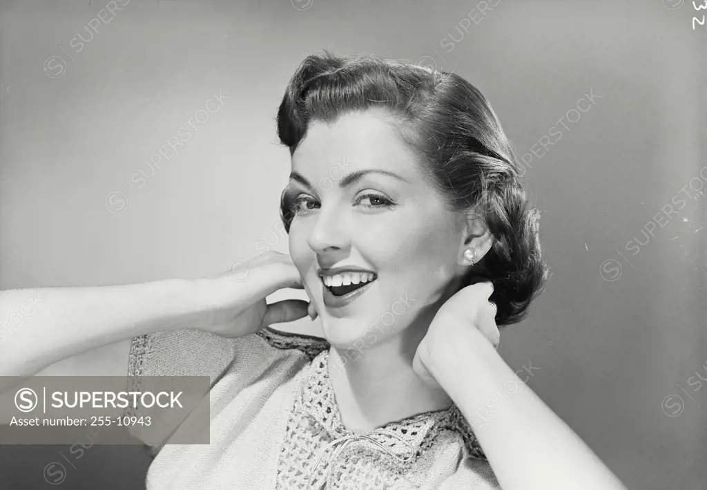 Vintage photograph. Portrait of young woman smiling.