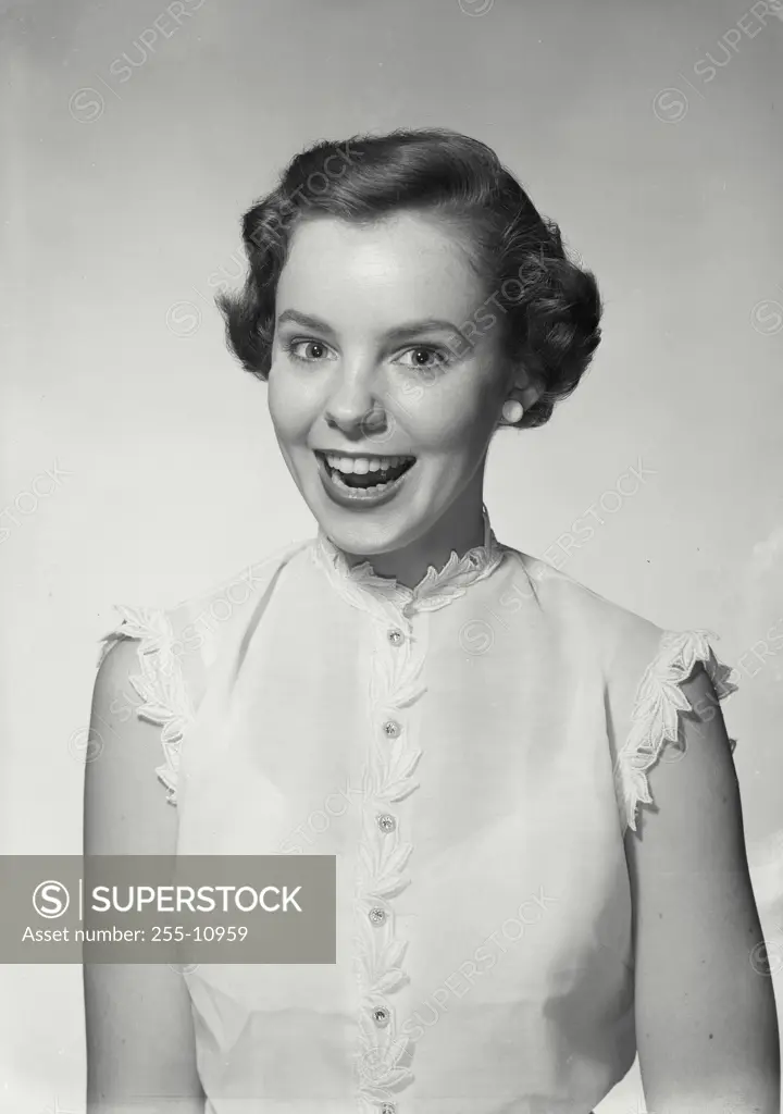 Vintage Photograph. Woman in sleeveless blouse smiling wide. Frame 3