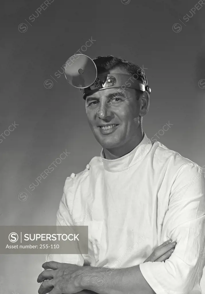 Vintage Photograph. Portrait of a male doctor wearing a headband