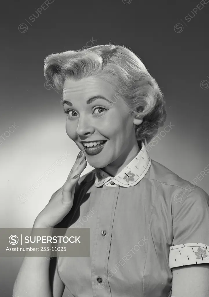 Vintage Photograph. Woman in button blouse smiling at camera. Frame 4