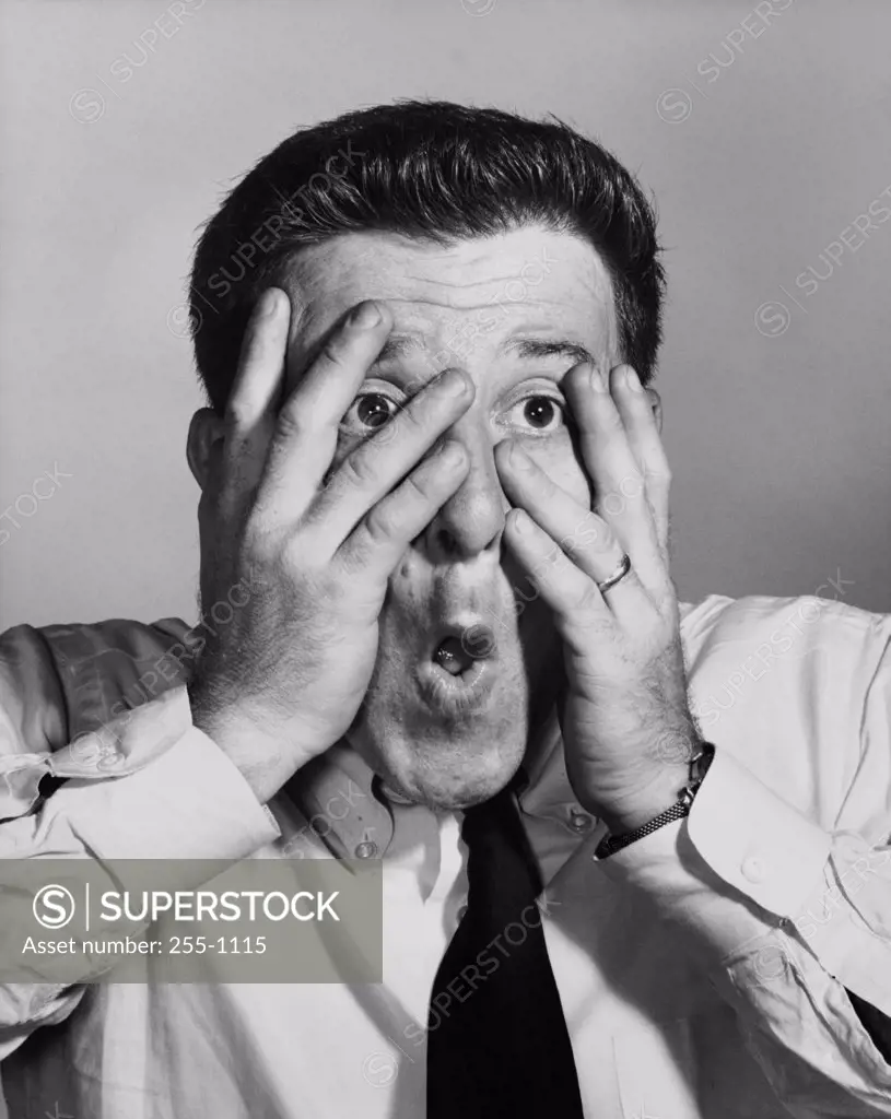 Close-up of a businessman looking shocked