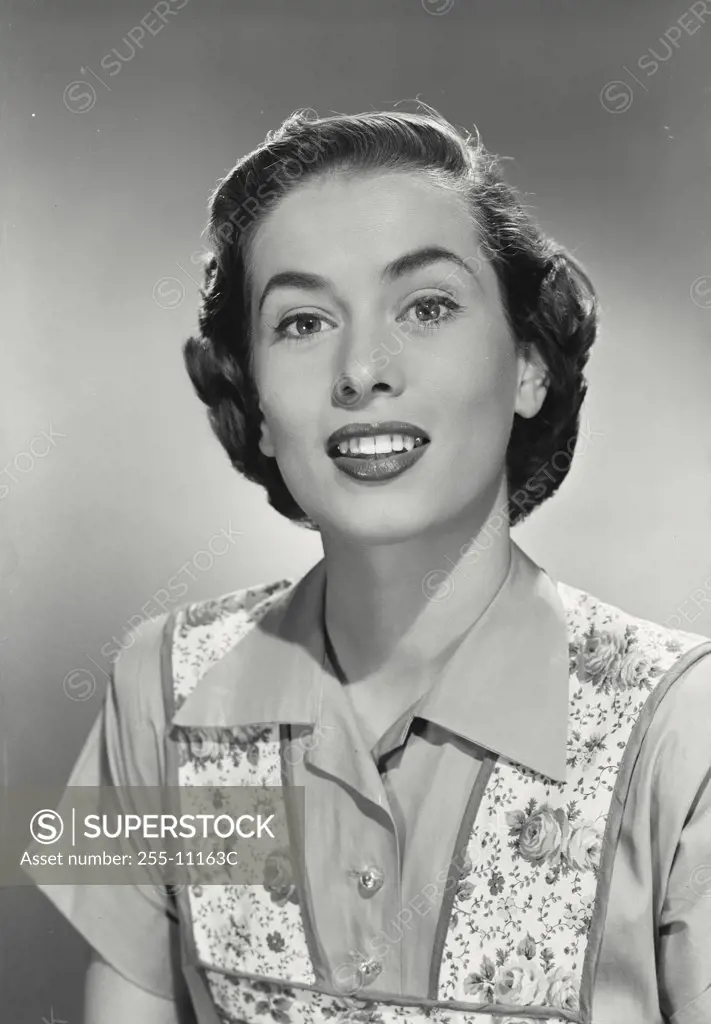 Portrait of brunette woman wearing flowery vest