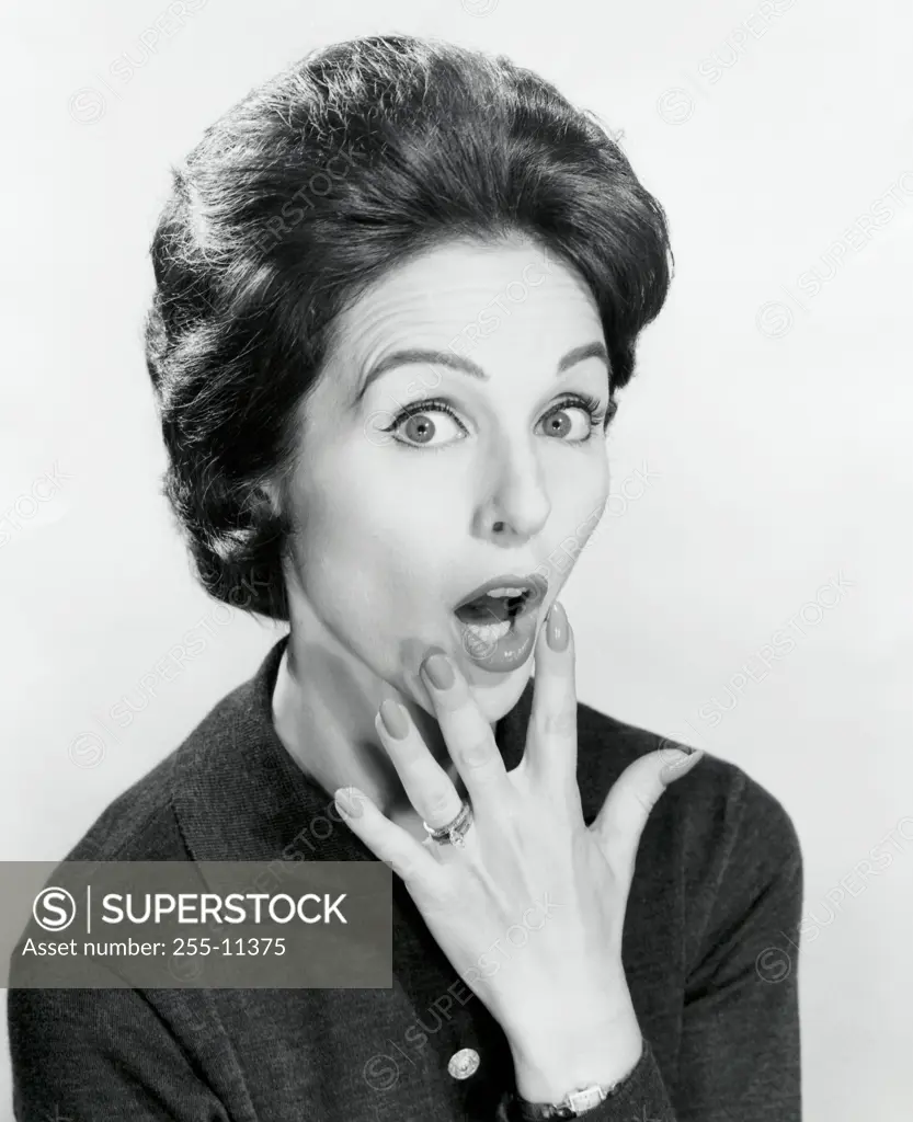 Portrait of a mid adult woman looking surprised