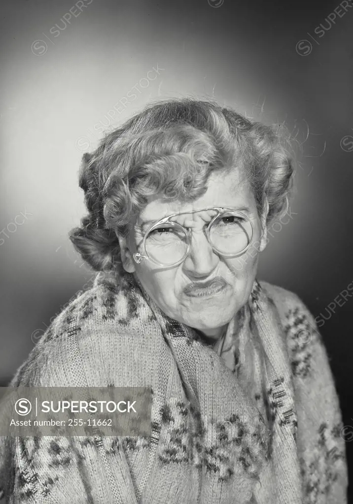 Vintage Photograph. Older woman wearing glasses and shawl making comical scrunchy face