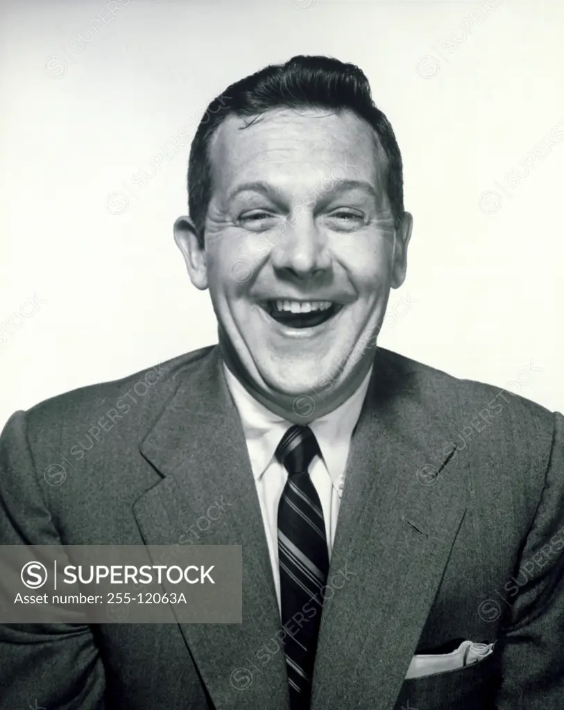 Portrait of mid adult man laughing