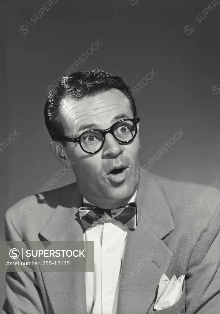 Vintage photograph. Close-up of a businessman looking surprised
