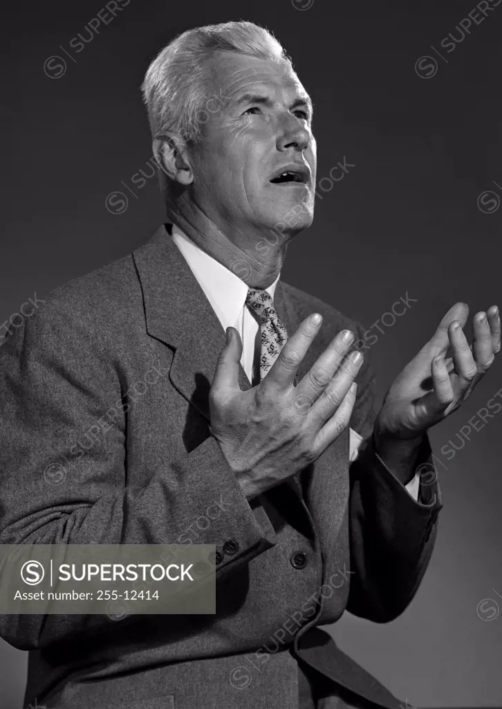 Studio portrait of man gesturing