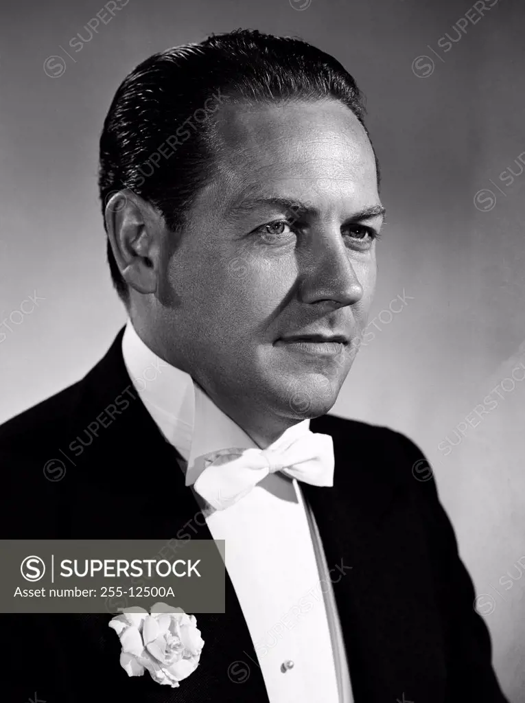 Studio portrait of mid adult man in tuxedo
