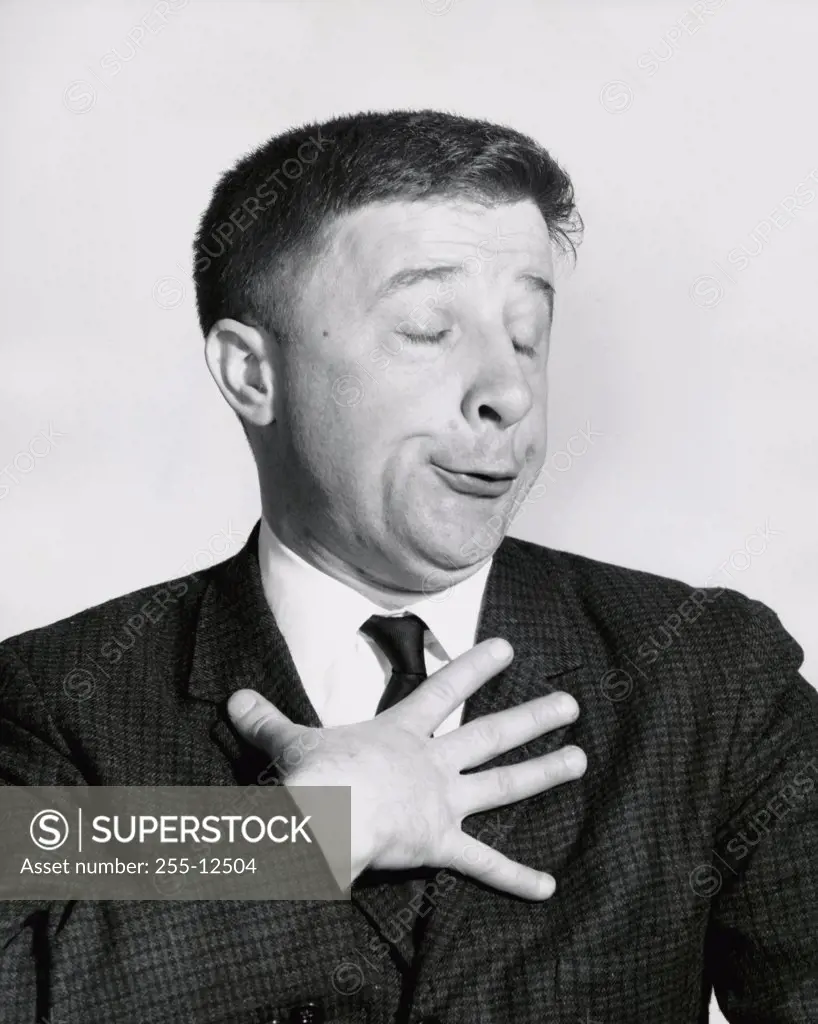 Close-up of a businessman making a funny face