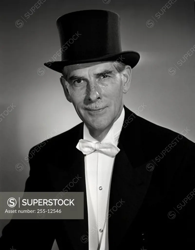 Studio portrait of man wearing top hat