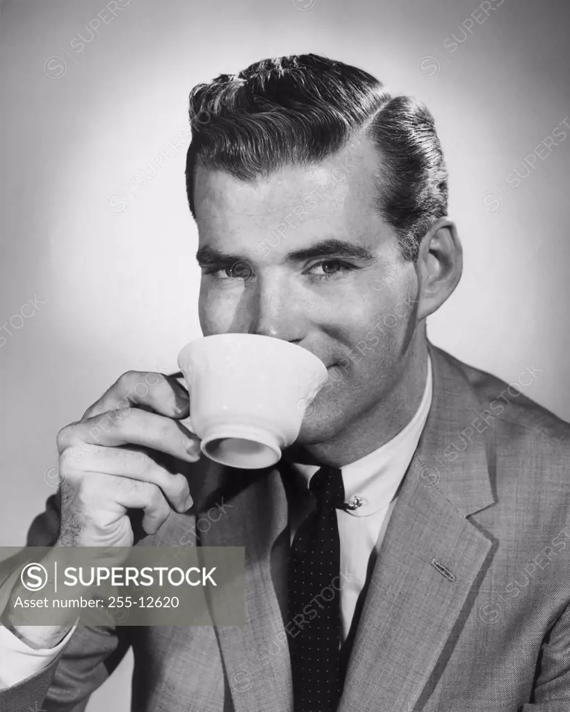 Portrait of a mid adult man drinking from a tea cup