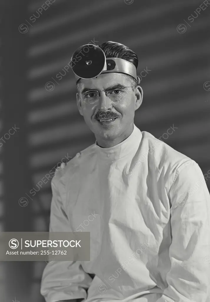 Vintage Photograph. Portrait of a male doctor wearing a headband