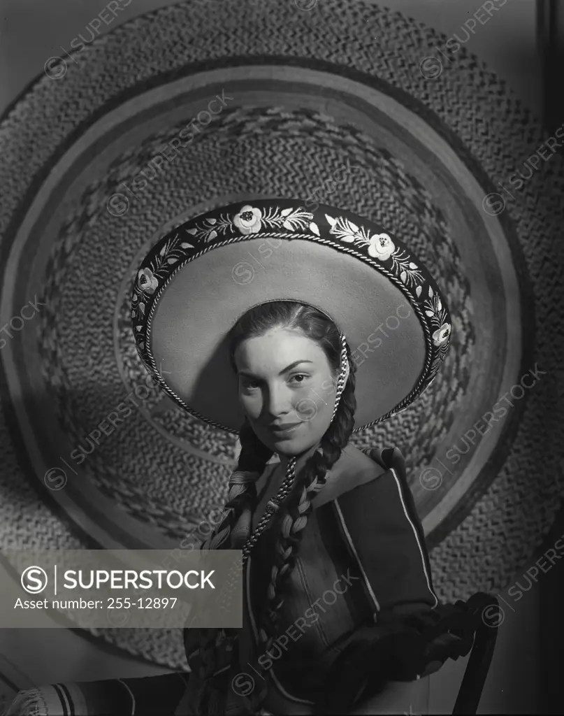Vintage Photograph. Mexican woman wearing a large hat