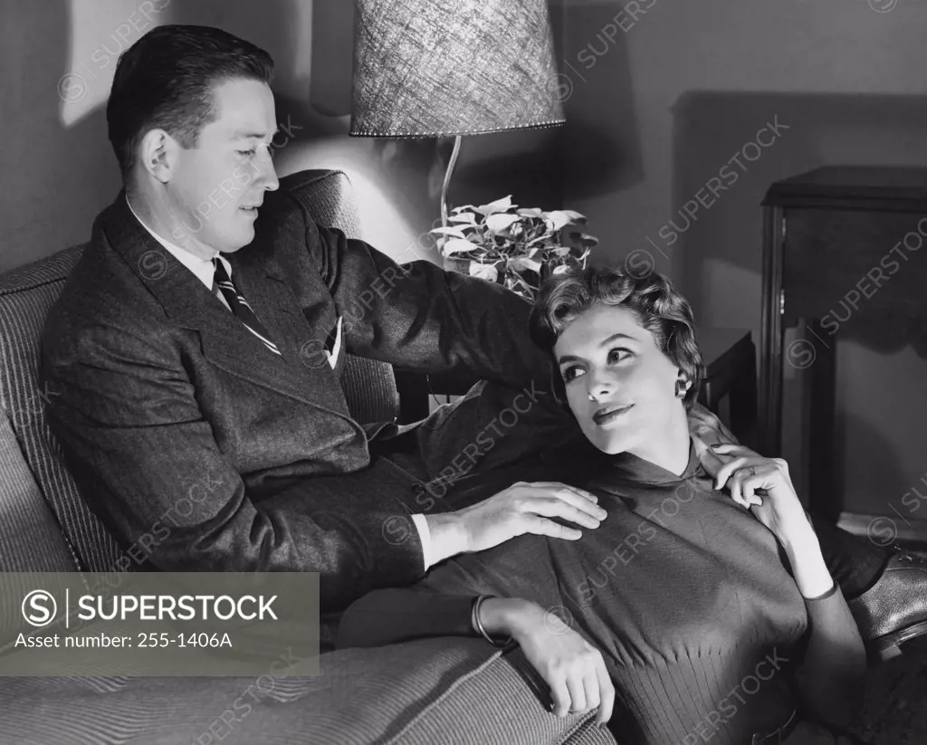 High angle view of a young couple sitting in a living room