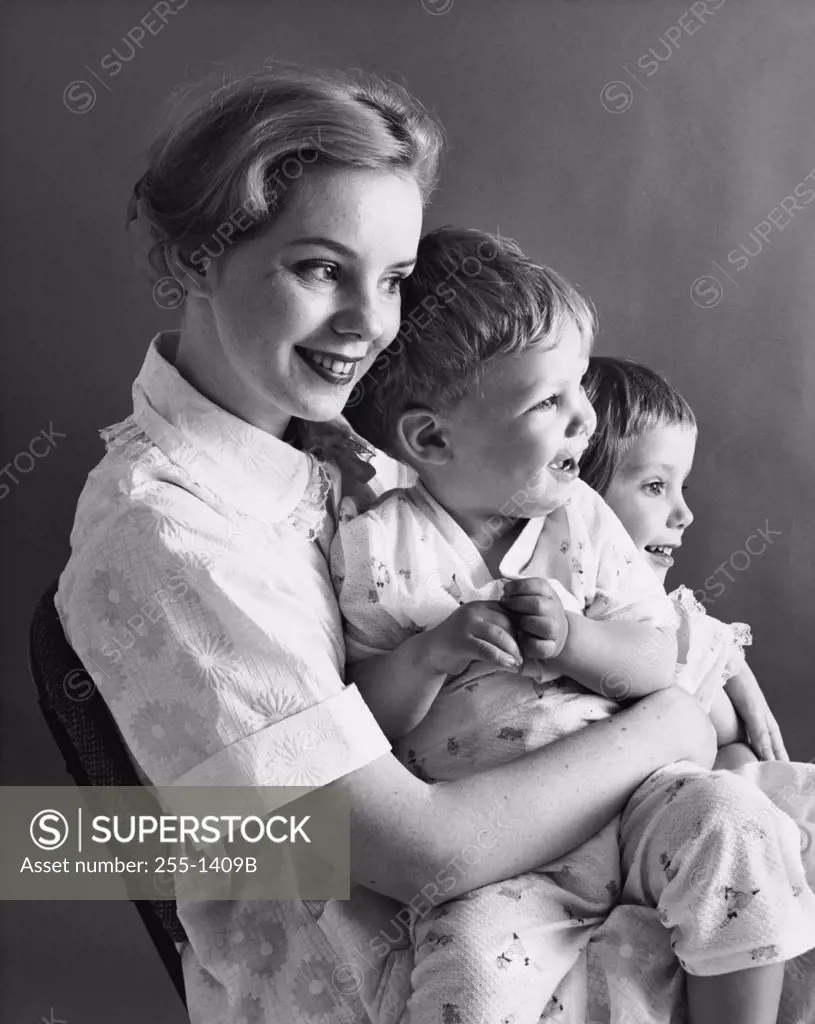 Side profile of a mother sitting with her children