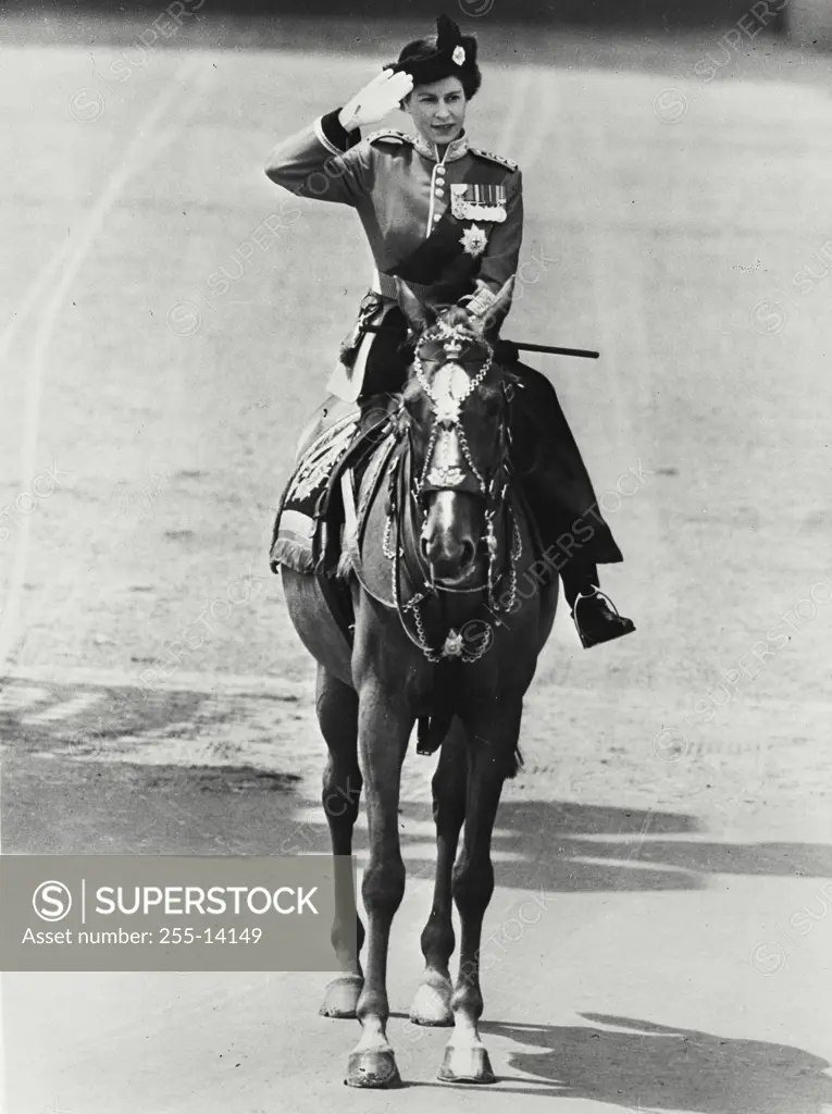 Vintage photograph. Queen Elizabeth II taking the salute at Trooping the Color ceremony. For the first time in history a reigning Queen took part in the traditional Trooping the Color ceremony