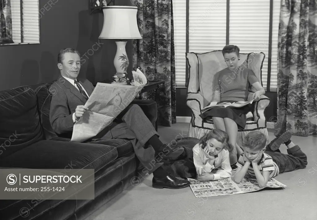 Vintage Photograph. Family in living room enjoying quality time together. Frame 1