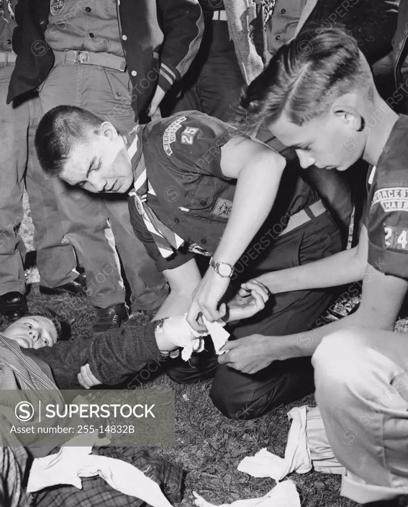 Boy scouts learning first aid