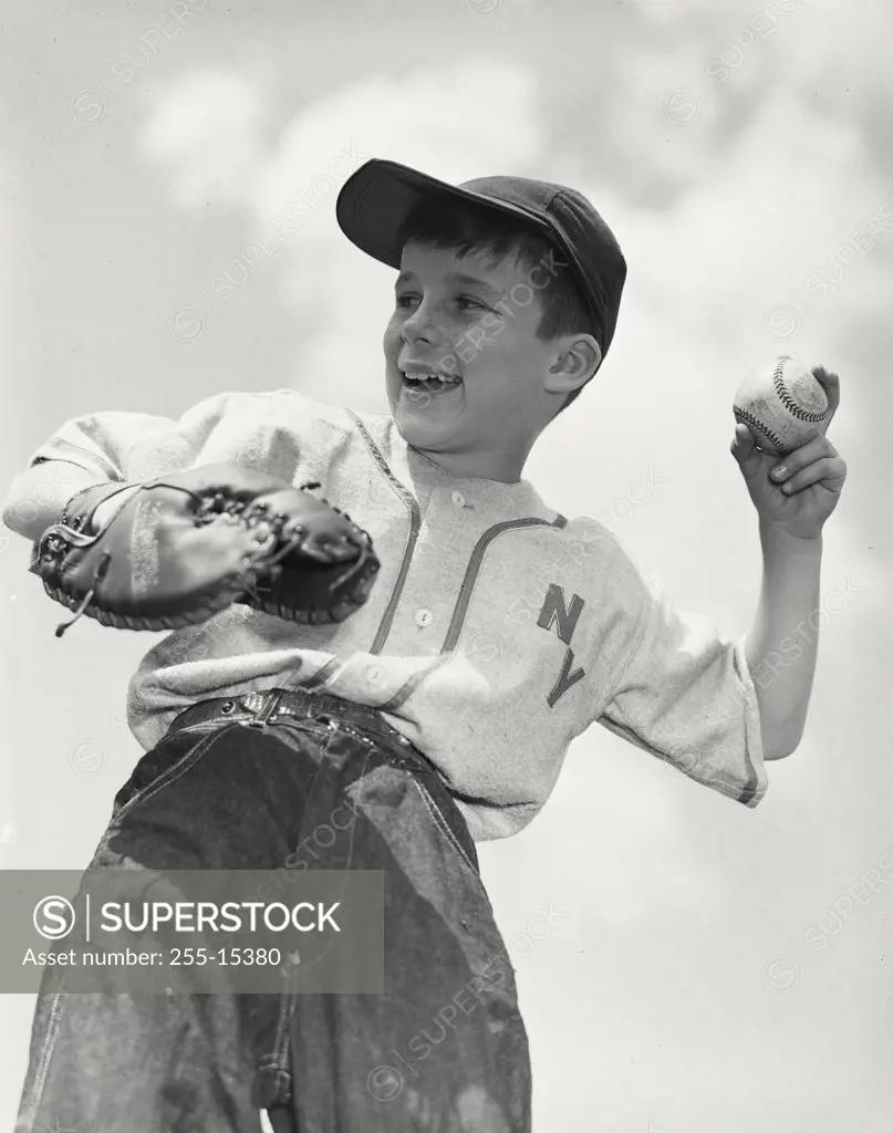 Young baseball player about to throw ball