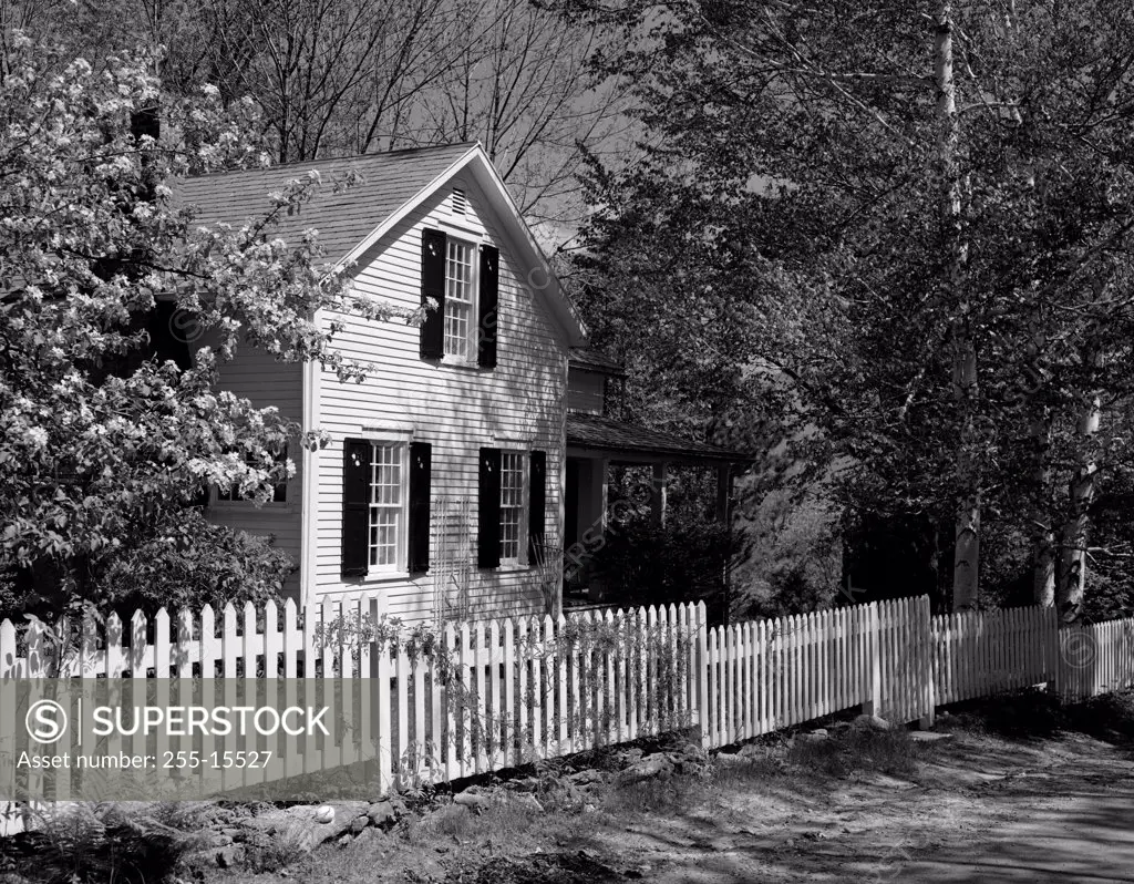 Picket fence in front of a house