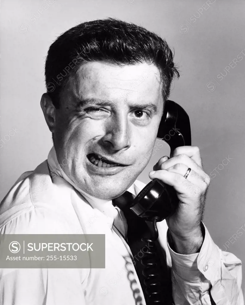 Close-up of a businessman using a telephone