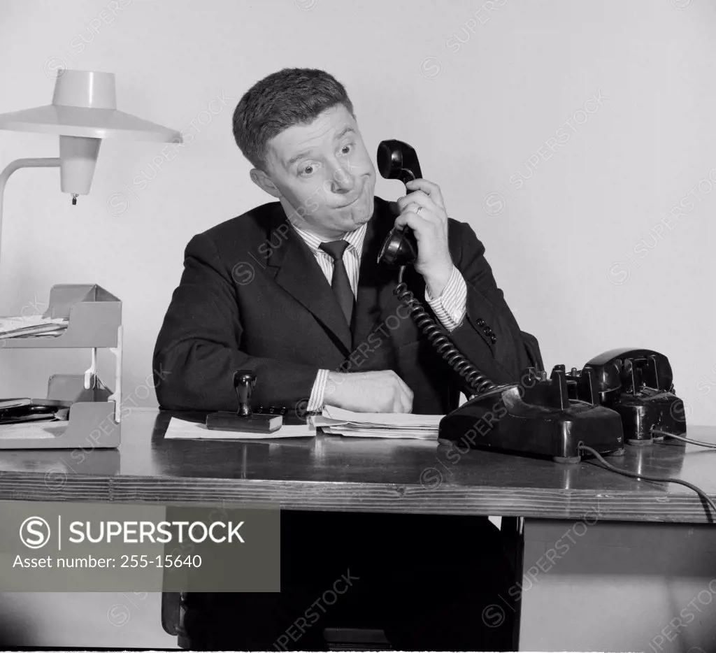 Businessman using a telephone in an office