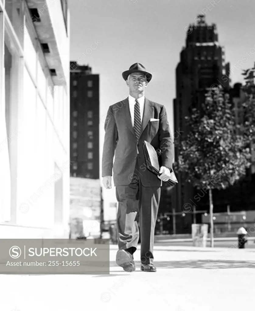 Vintage photograph of businessman walking in downtown