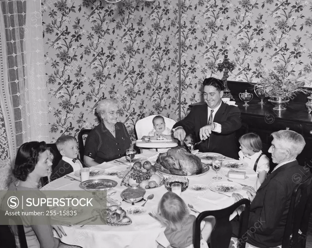 Family at a dining table on Thanksgiving Day