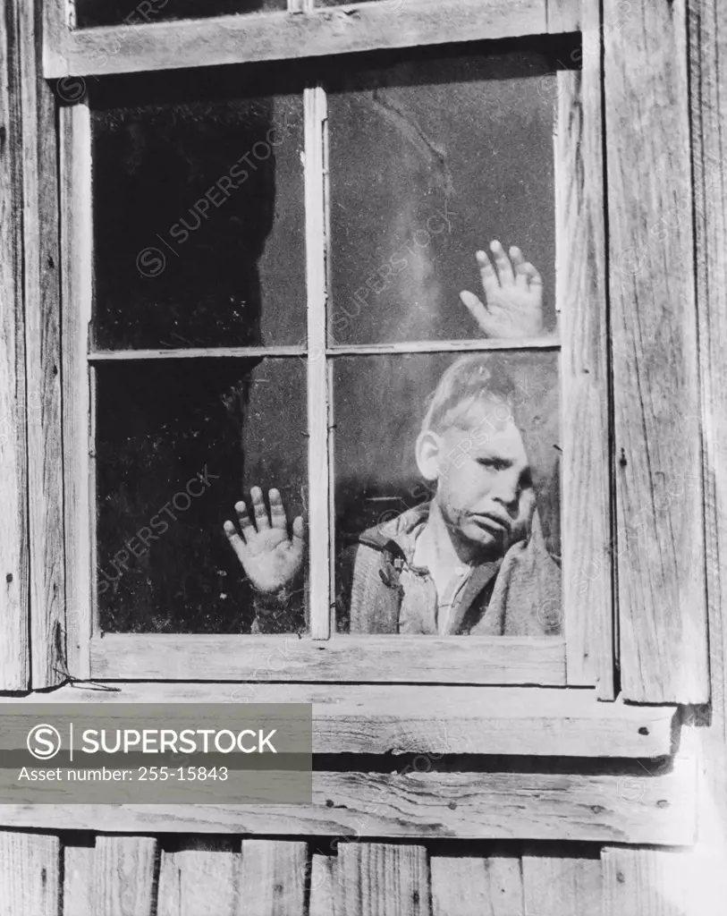 Boy looking through a window