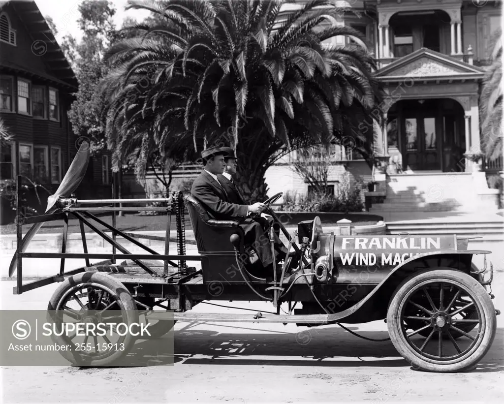 Vintage photograph of inventors in Vintage 'wind machine' van