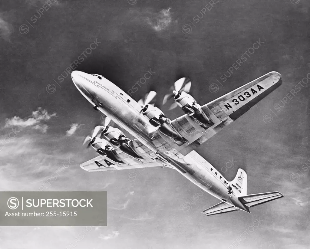 Low angle view of an Douglas DC-7 airplane flying in the sky