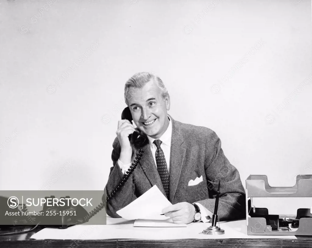 Businessman talking on the telephone in an office