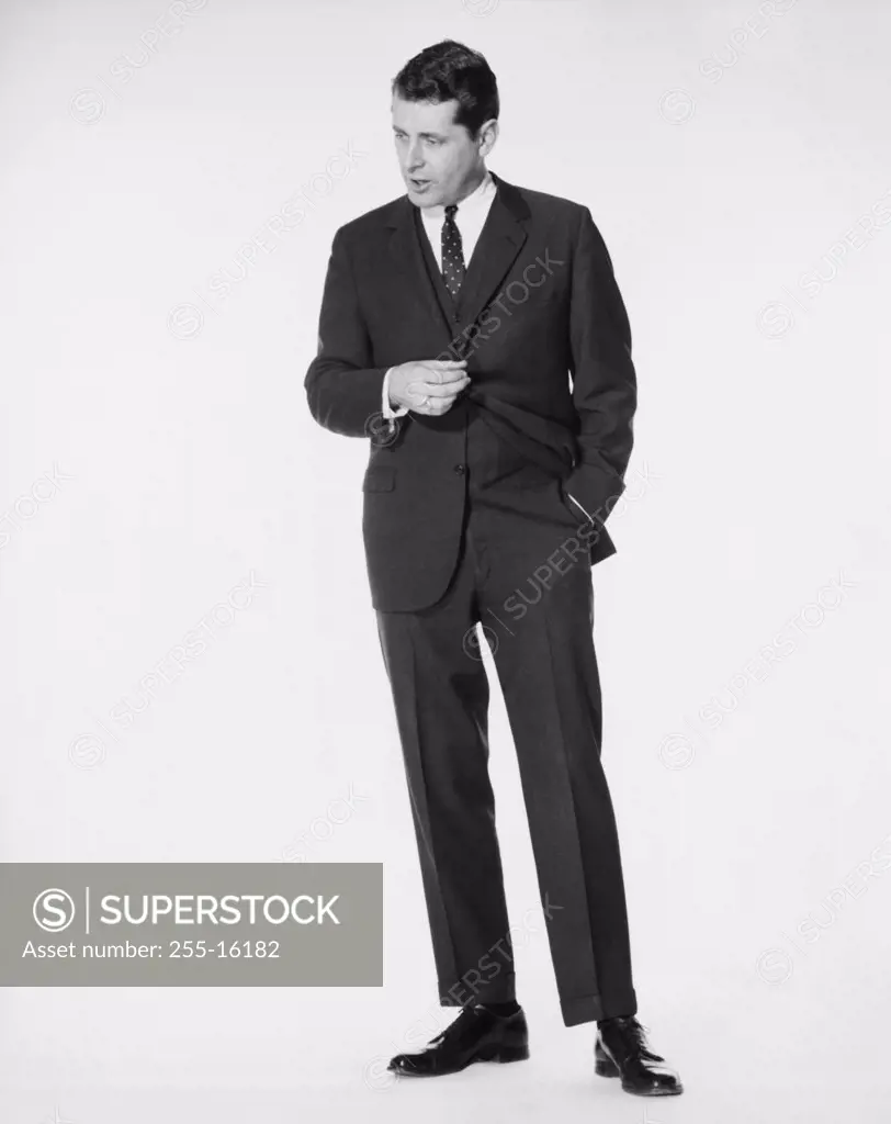 Businessman standing with one hand in his pocket
