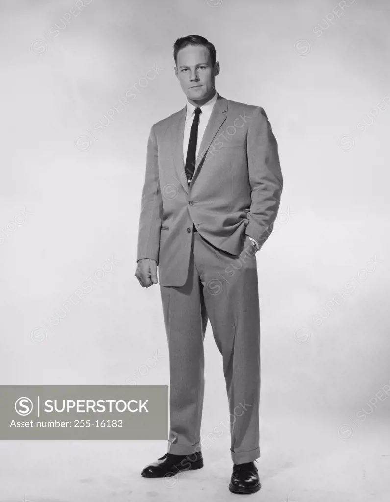 Portrait of a businessman standing with one hand in his pocket