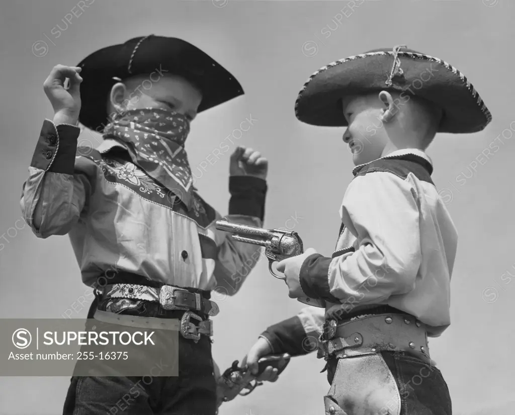 Two boys in cowboy costumes