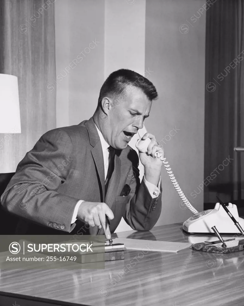 Businessman arguing on the telephone