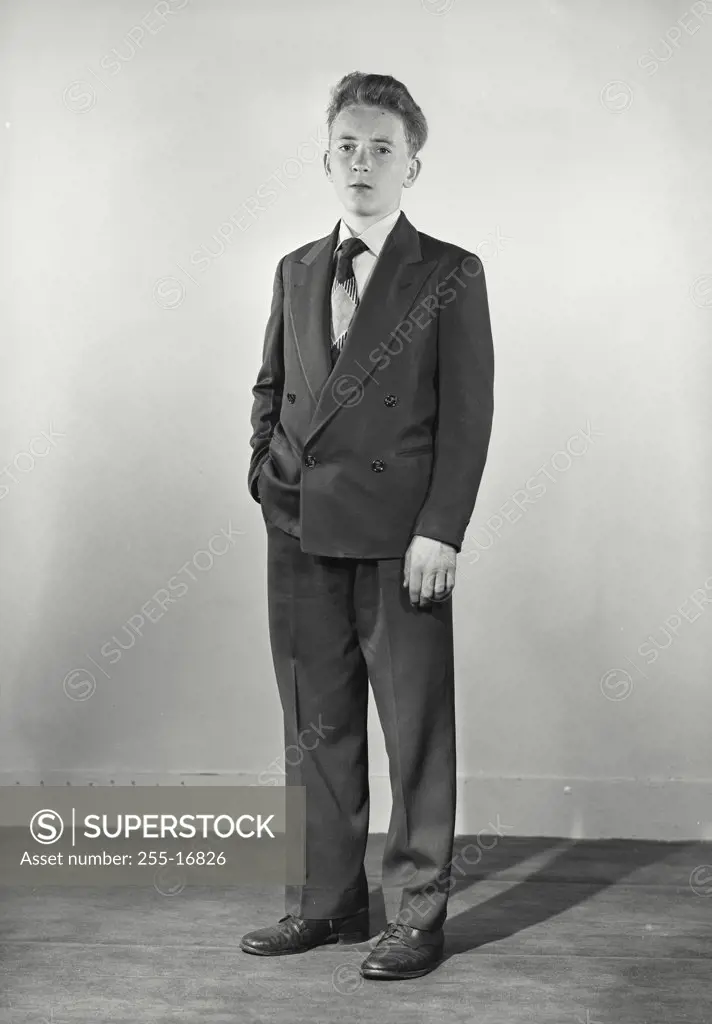 Vintage photograph. Young man dressed in Suit hand in pocket