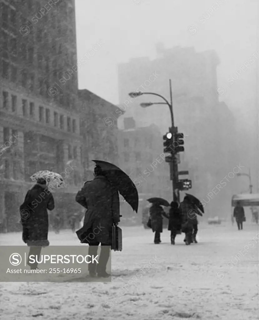 Group of people walking during a blizzard, New York City, USA
