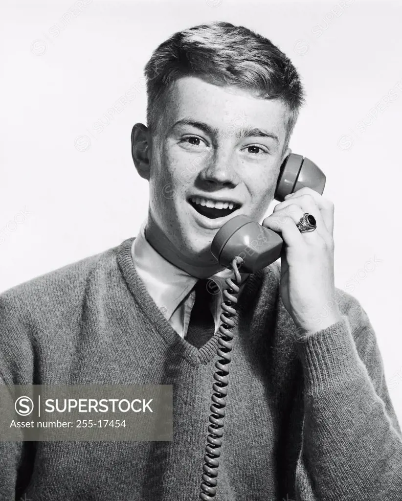 Portrait of a teenage boy talking on the phone, 1965