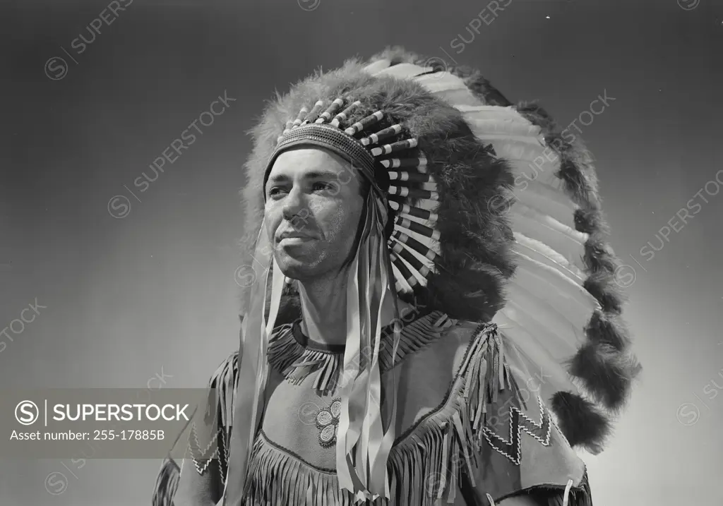 Vintage Photograph. Caucasian man in Native American head dress. Frame 3