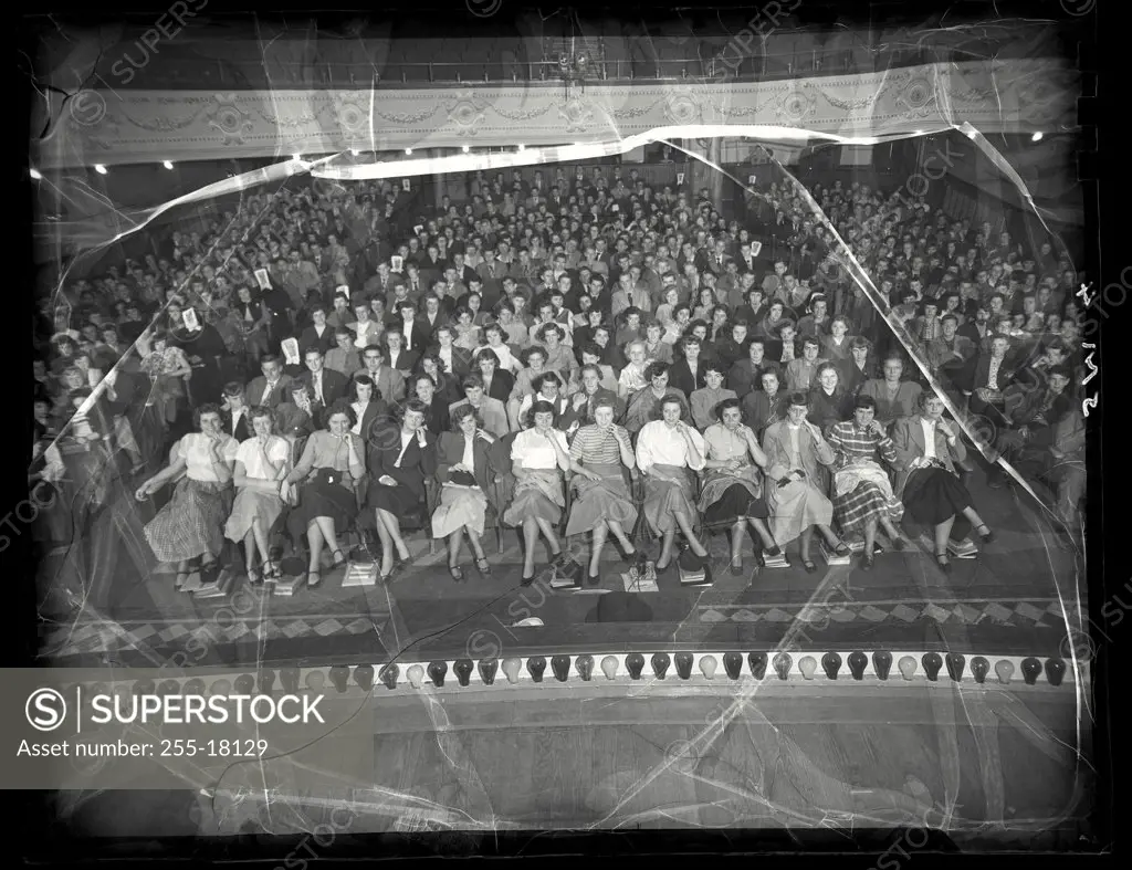 Vintage photograph. High angle view of students sitting at a high school assembly